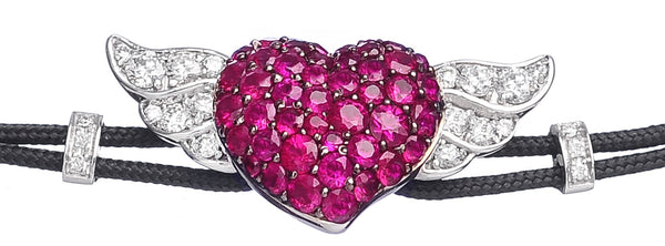 BRACELET WITH HEART  AND  WINGS IN GOLD WITH RUBIES AND DIAMONDS