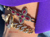 BRACELET WITH CROSS IN GOLD WITH DIAMONDS AND RUBIES