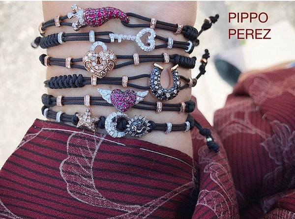 BRACELET WITH HEART  AND  WINGS IN GOLD WITH RUBIES AND DIAMONDS